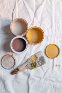 Using a drop cloth while painting an interior helps reduce spills, splatters, and stains.