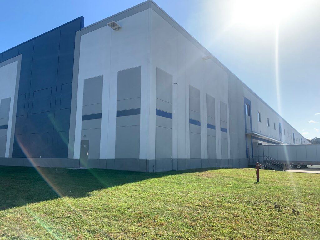 Completed view of exterior painting a commercial building