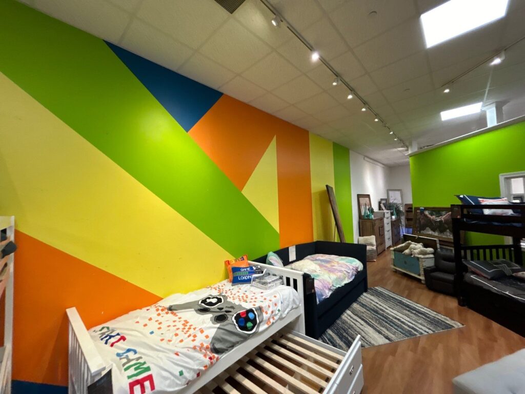 Furniture sales floor walls painted bright stripes