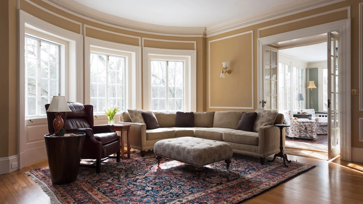 interior-painting A living room with a couch and a rug.