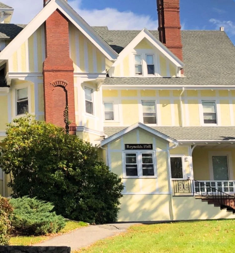 ArchCentral2 Premier Central Massachusetts Painters transformed a yellow house with white trim and a porch into a stunning work of art.